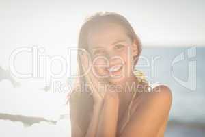 Brunette relaxing and smiling at camera