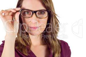 Pretty woman with glasses looking at camera