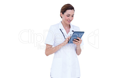 Smiling doctor using tablet