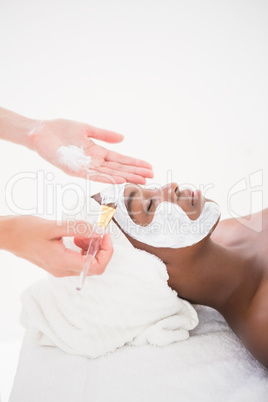 Pretty woman getting a facial treatment