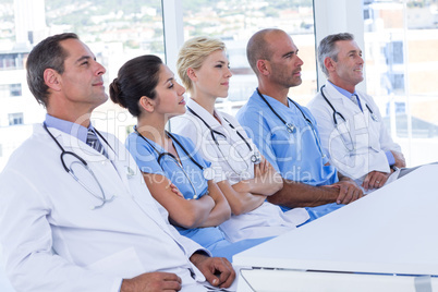 Team of doctors listening during meeting