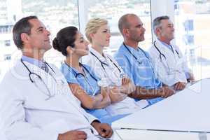 Team of doctors listening during meeting