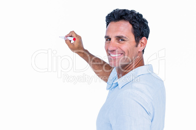 Handsome man writing something with red markers