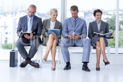 Business people waiting to be called into interview