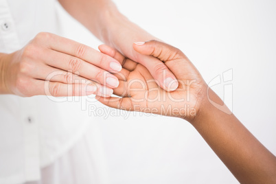 A woman enjoying a hand massage