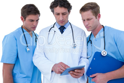 Doctors and nurses using laptop