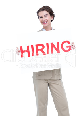Businesswoman holding a hiring sign