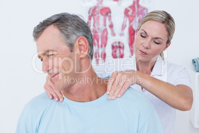 Doctor stretching her patient neck