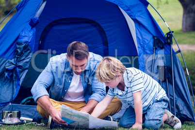 Father and son camping in the park