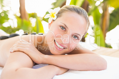 Peaceful blonde lying on towel