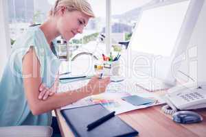 Creative businesswoman drawing plans using colour watch