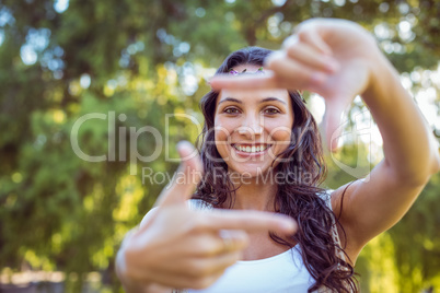 Pretty brunette framing with hands