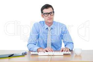 Businessman typing at his desk