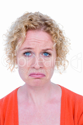 Unhappy blonde woman looking at camera