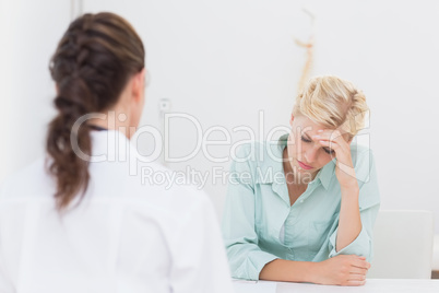 Patient with headache visiting doctor