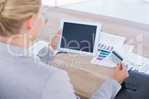 Businesswoman holding tablet and credit card