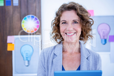 Creative businesswoman using tablet computer