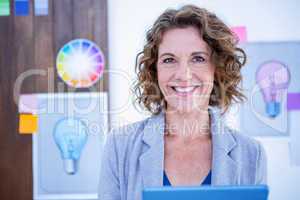 Creative businesswoman using tablet computer