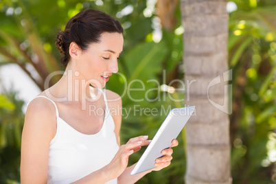 woman in white using her phone