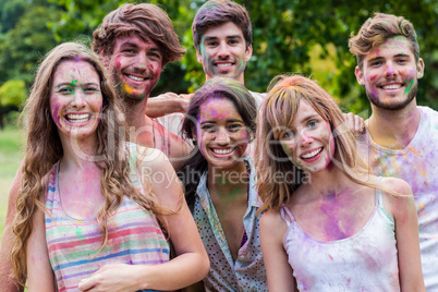 Happy friends covered in powder paint