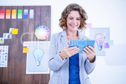 Creative businesswoman using tablet computer