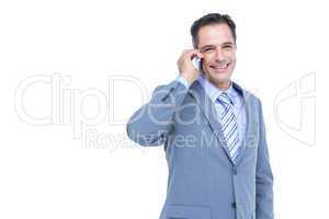 Portrait of a successful businessman on phone against white
