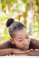 Beautiful young woman on massage table