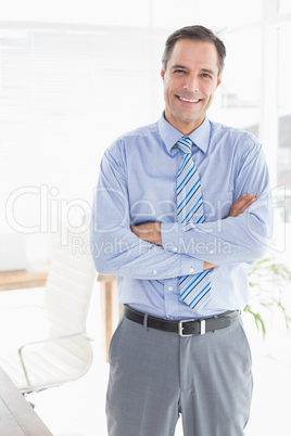 Smiling businessman looking at camera