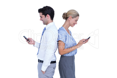 Business people using smartphone back to back