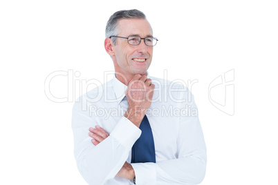 thinking businessman standing with hand on chin