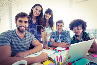 Portrait of happy creative business team in a meeting