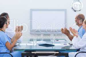 Team of doctor applauding during meeting