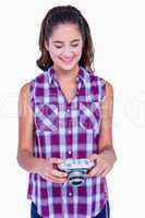 Pretty brunette holding photo camera