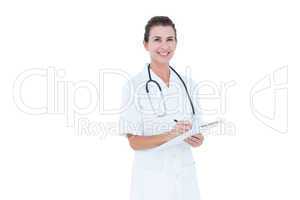 image of doctor smiling and holding clipboard and pen
