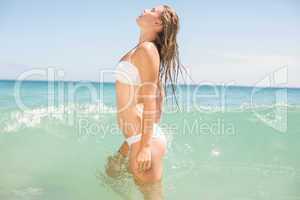 Pretty blonde bathing into the sea