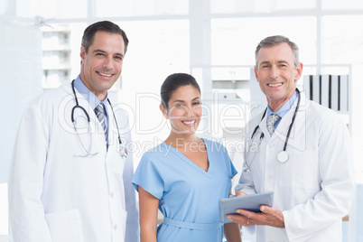 Doctors and nurse looking at camera