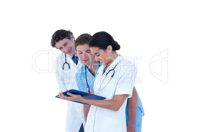 Doctors and nurses discussing over notes