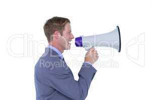 Businessman talking through megaphone