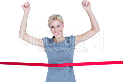 Happy businesswoman cutting red ribbon Happy businesswoman cutting red ribbon