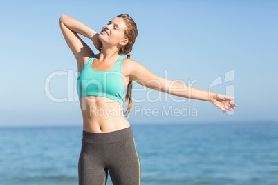 Beautiful fit woman stretching her neck