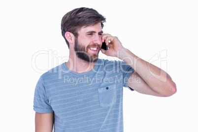 Happy handsome man having phone call