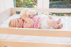 Bueatiful cute baby girl in her crib