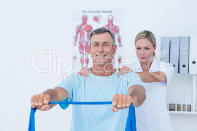 Doctor examining her patient back