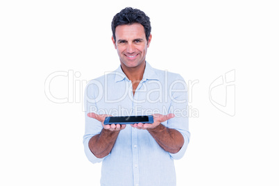 Handsome man showing his tablet computer