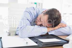 Sleeping businessman in his office