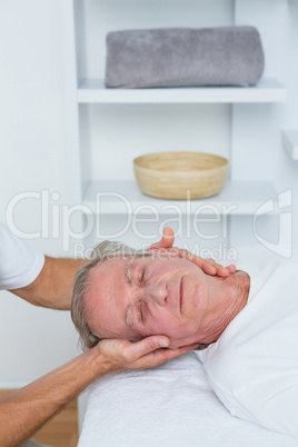 Man receiving neck massage