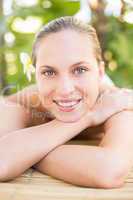 Peaceful blonde lying on massage table