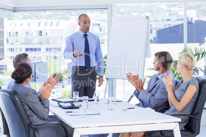 Business people applauding during meeting