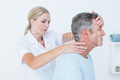 Doctor doing neck adjustment