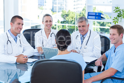 Team of doctors working on laptop